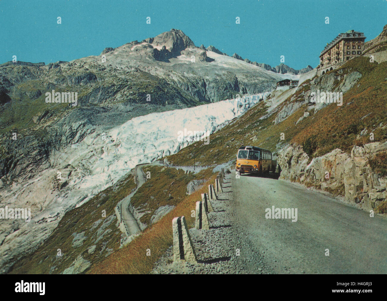 Vintage postcard circa showing the Furka pass Rhone Glacier and Belvedere Hotel a high mountain pass in the Swiss Alps. Circa 1960s Stock Photo