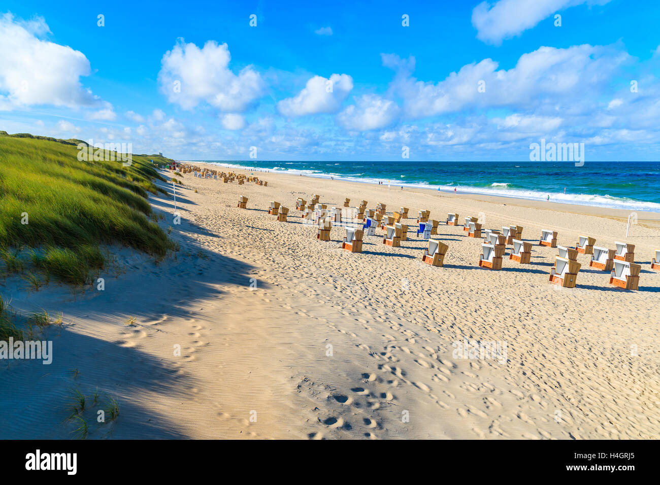 Chairs on sandy beach in Wenningsted town, Sylt island, Germany Stock Photo