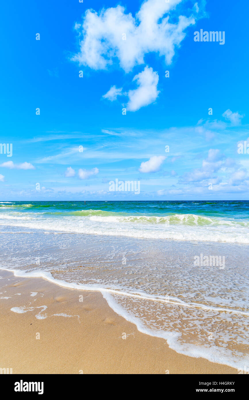 Beautiful waves on sandy beach hi-res stock photography and images - Alamy