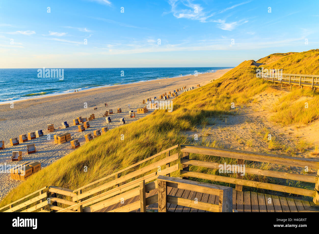Steps to idyllic North Sea beach at sunset time, Sylt island, Germany Stock Photo