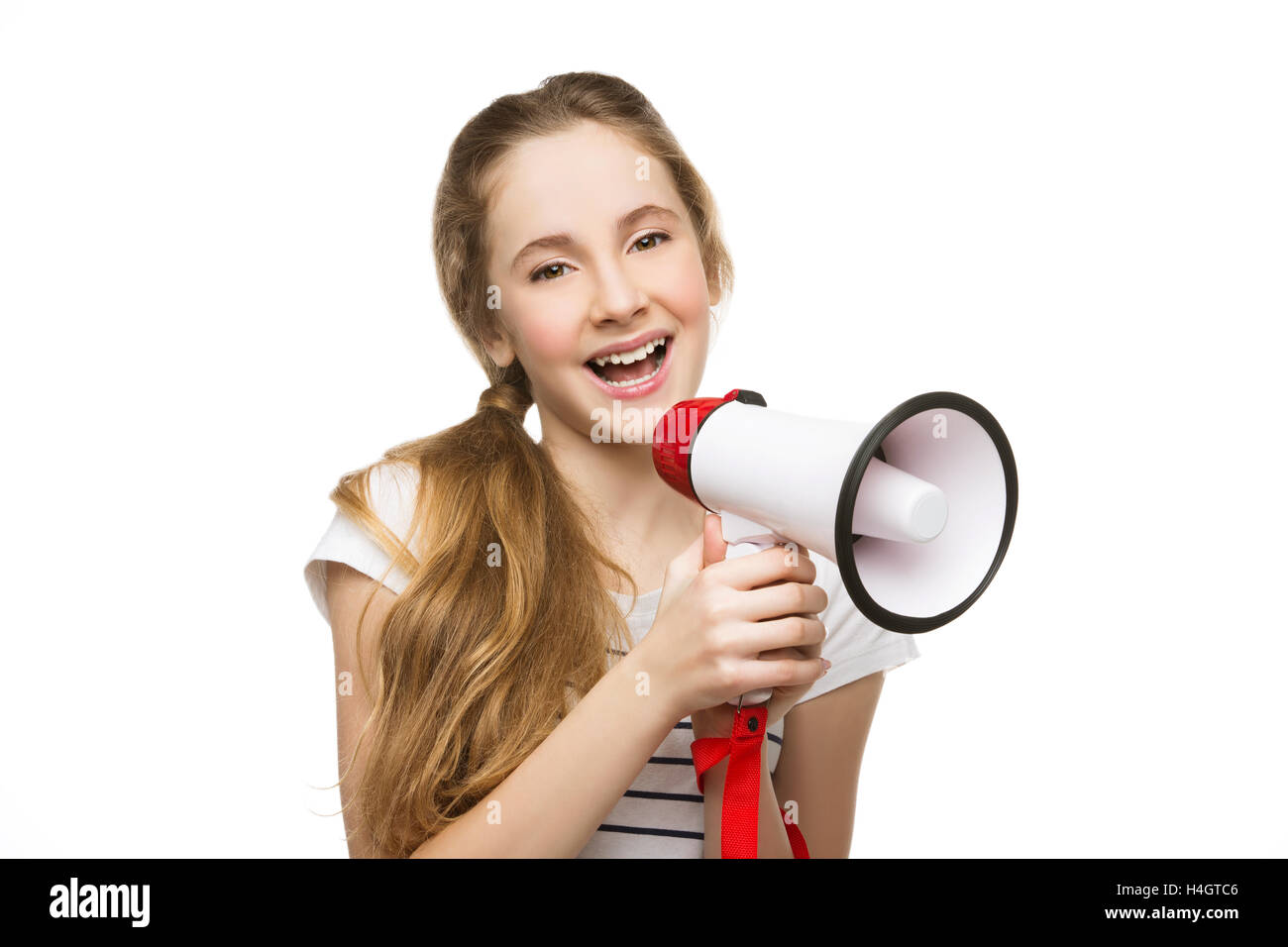 Teenage girl screaming in megaphone Stock Photo - Alamy