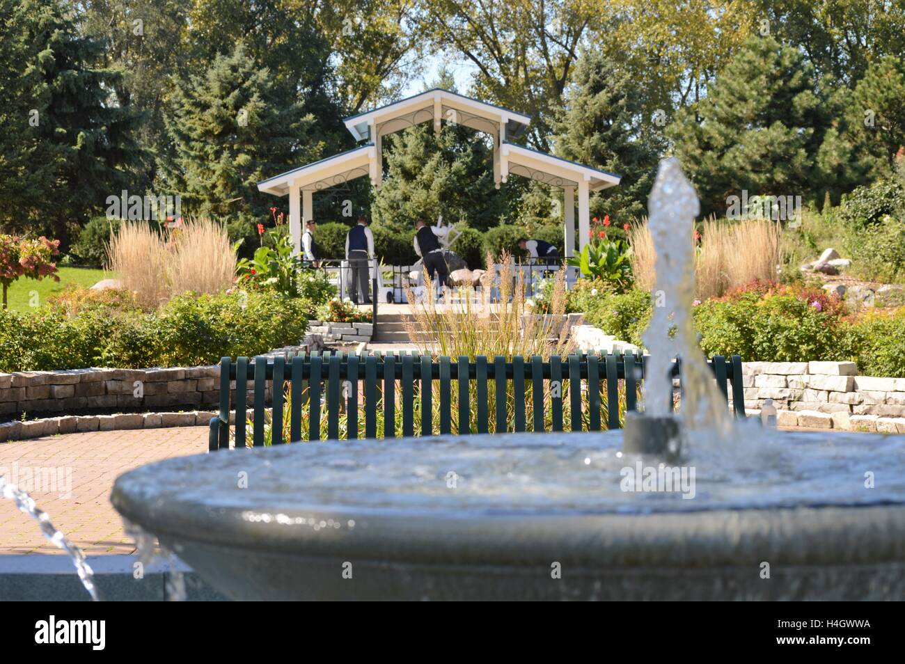 Water Fountain and Wedding Party Setting Up at the Park Stock Photo Alamy