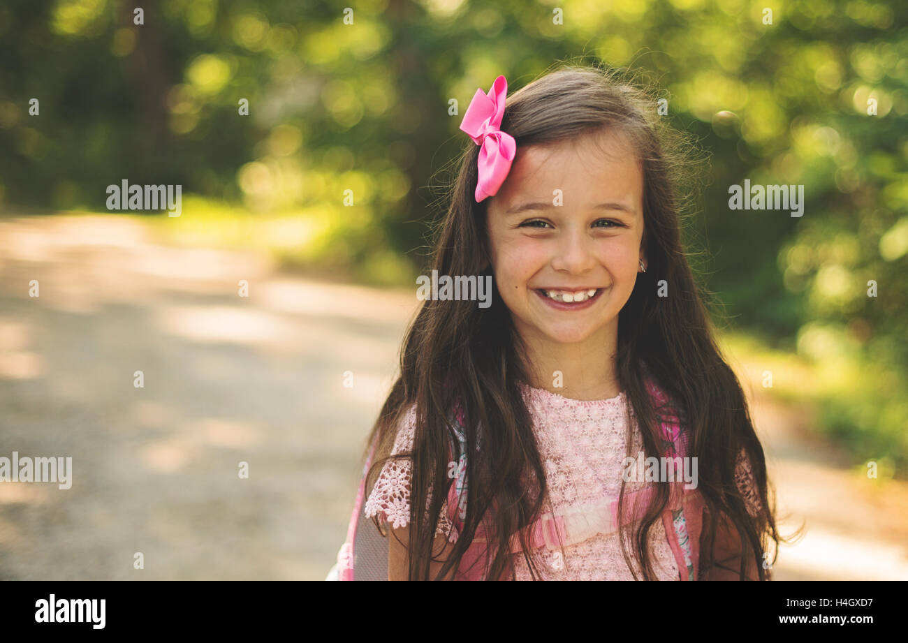 Young girl smiling to the camera Stock Photo - Alamy