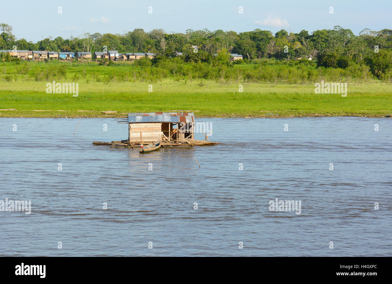 IQUITOS, PERU - OCTOBER 16, 2015: Floating Shack on the Itaya River. Fishing is a source of food and commerce in the Peruvian Am Stock Photo