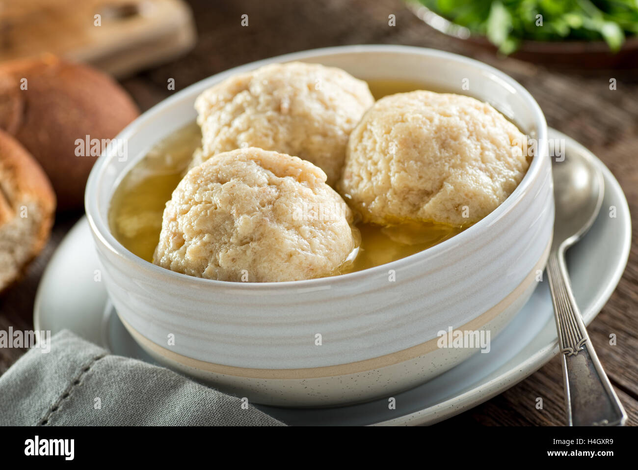 A bowl of delicious homemade authentic matzo ball soup. Stock Photo