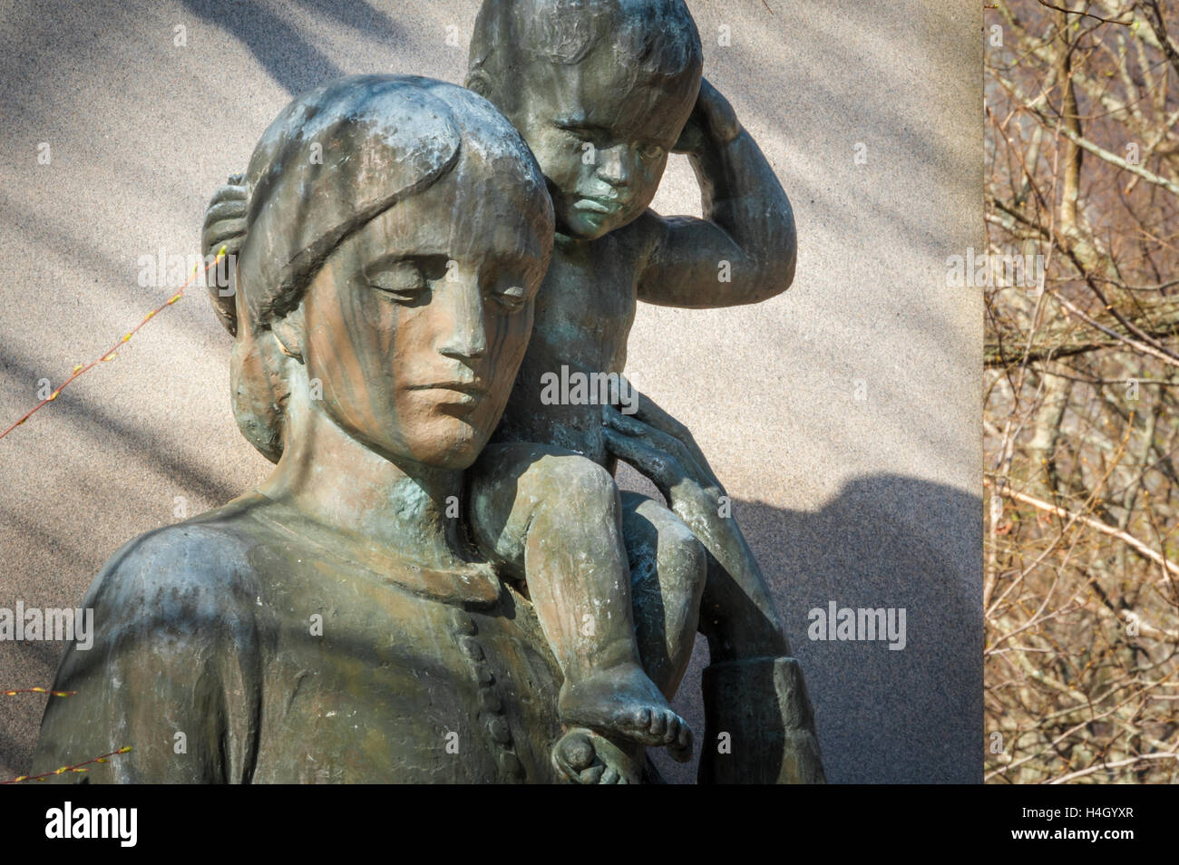 Mother and child bronze statue titled 'Sacrifice' at the base of the Stone Mountain Confederate Memorial carving in Atlanta. Stock Photo