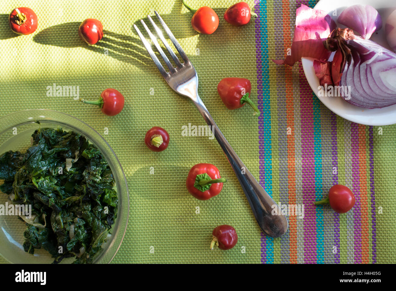 flat lay of spinaches and tropea onion with hot peppers Stock Photo