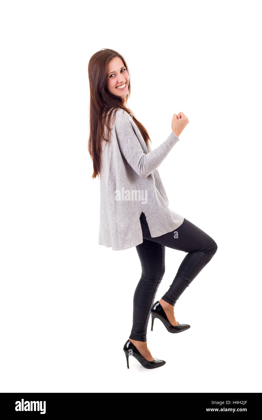 Studio shot: Happy woman with raised arms Stock Photo - Alamy