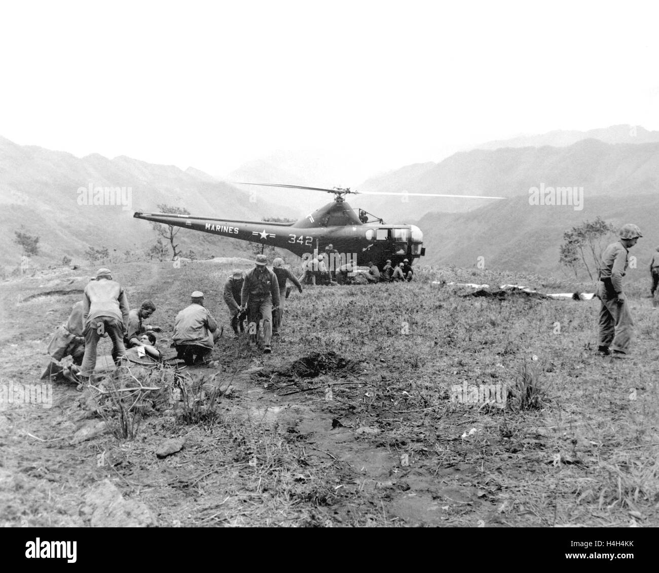 U.S. Marines wounded during fighting at Kari San Mountain are evacuated by helicopter to a MASH unit for medical care during the Korean War May 23, 1951 in Korea. Stock Photo