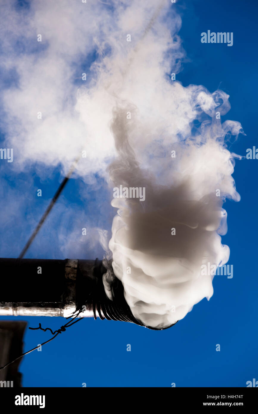 Old stove is smoking from the flue Stock Photo Alamy