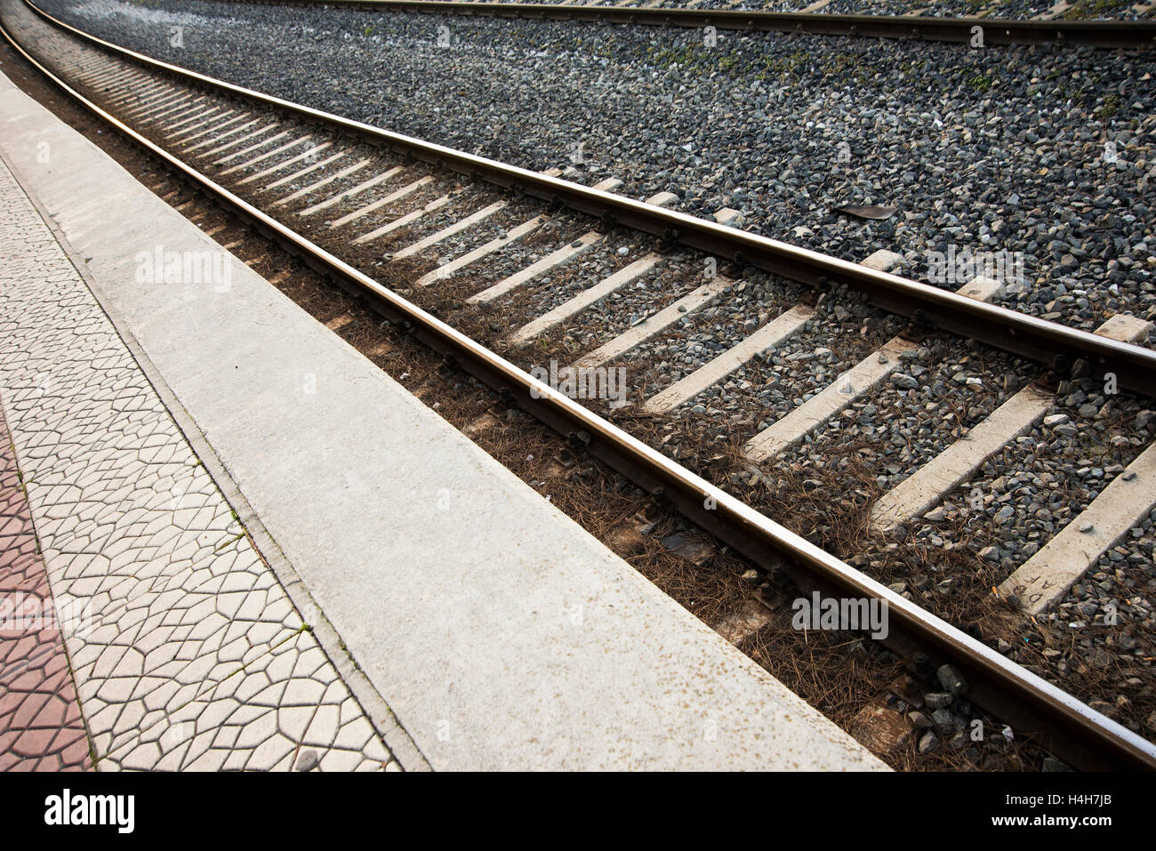 Railroad track view of a train station Stock Photo Alamy