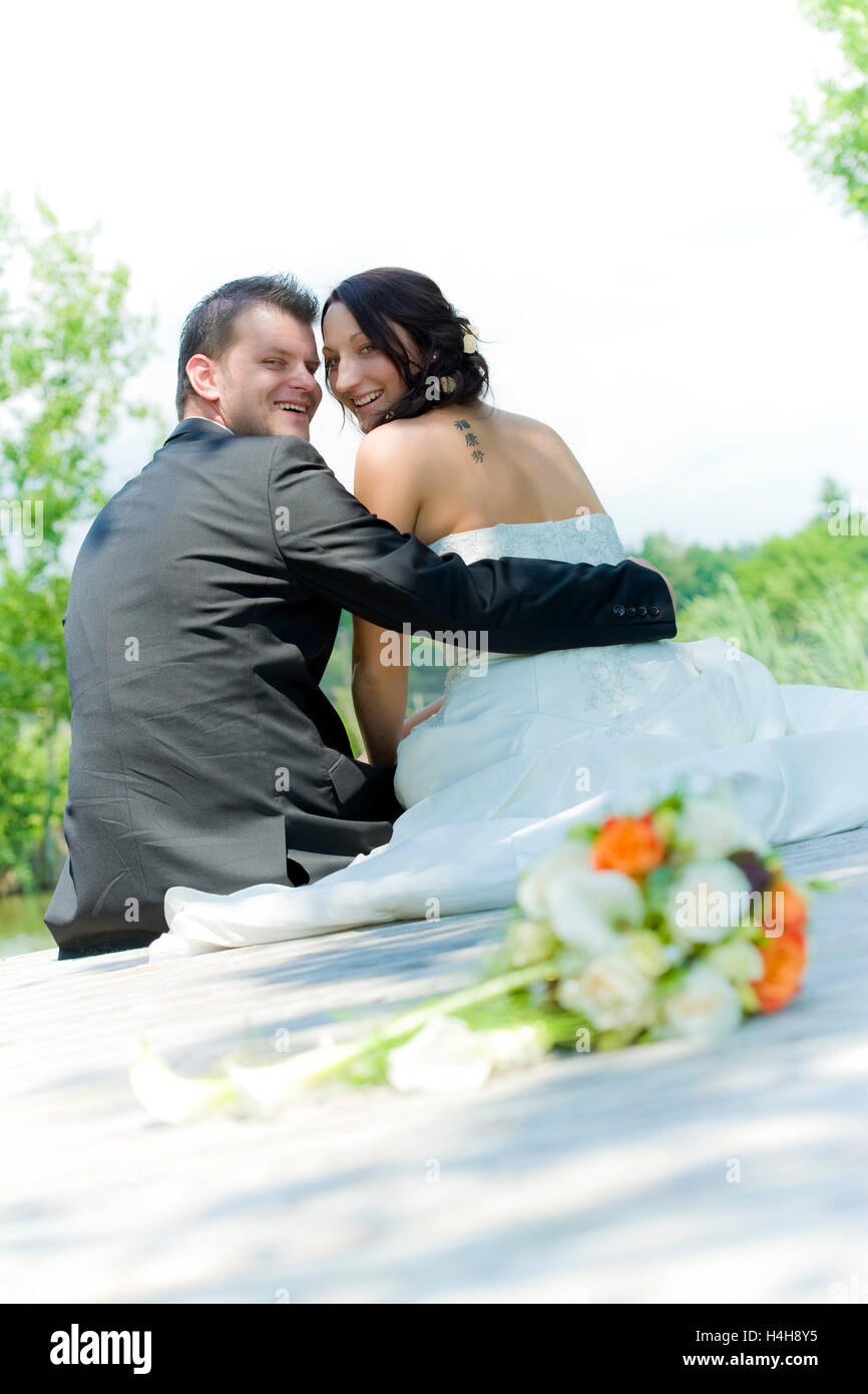 Bride and groom back view sitting hi-res stock photography and images ...