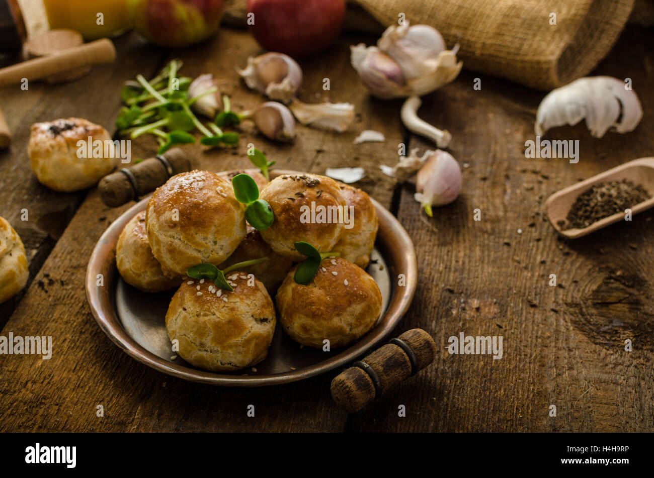 Cheese mini buns from home dough, sprinkled with sesame seeds, poppy ...