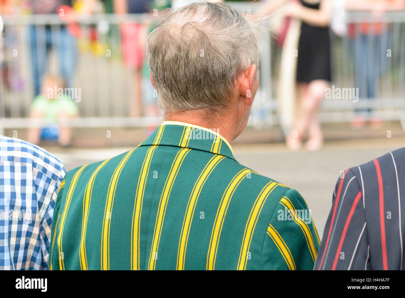 Men looking dapper in striped blazers watching parade at the River Festival in Bedford, Bedfordshire, England Stock Photo