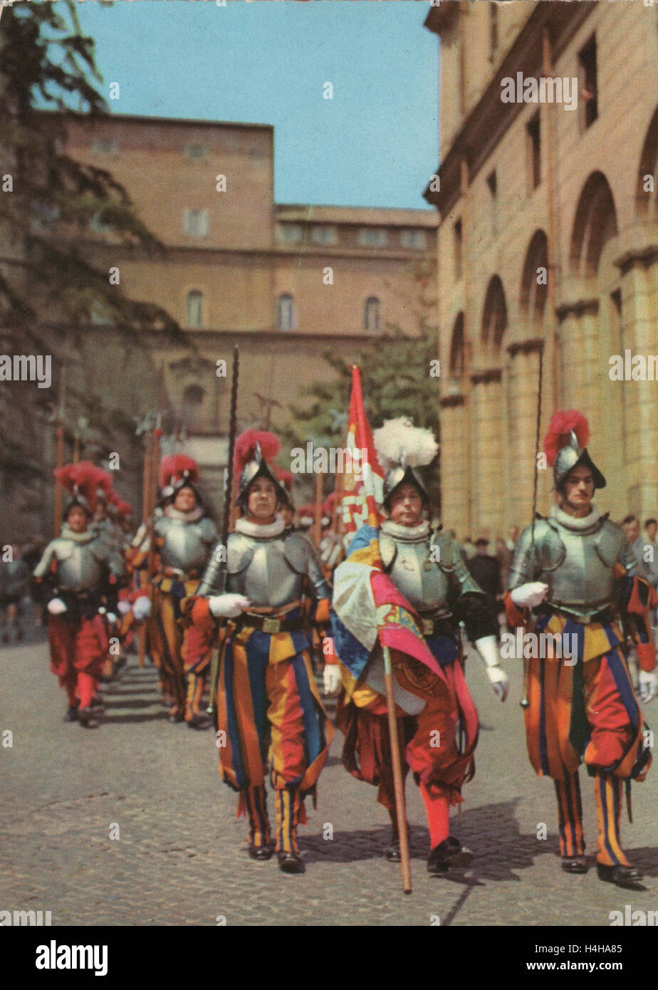 Vintage colour postcard circa 1950 showing the Pontifical Swiss Guard of the Holy See stationed at the Vatican. Stock Photo