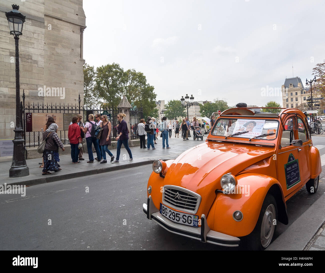 PARIS - SEPT 17, 2014: Old Citroen 2CV parked at cathedral Notre-Dame de Paris, Paris, France. Stock Photo