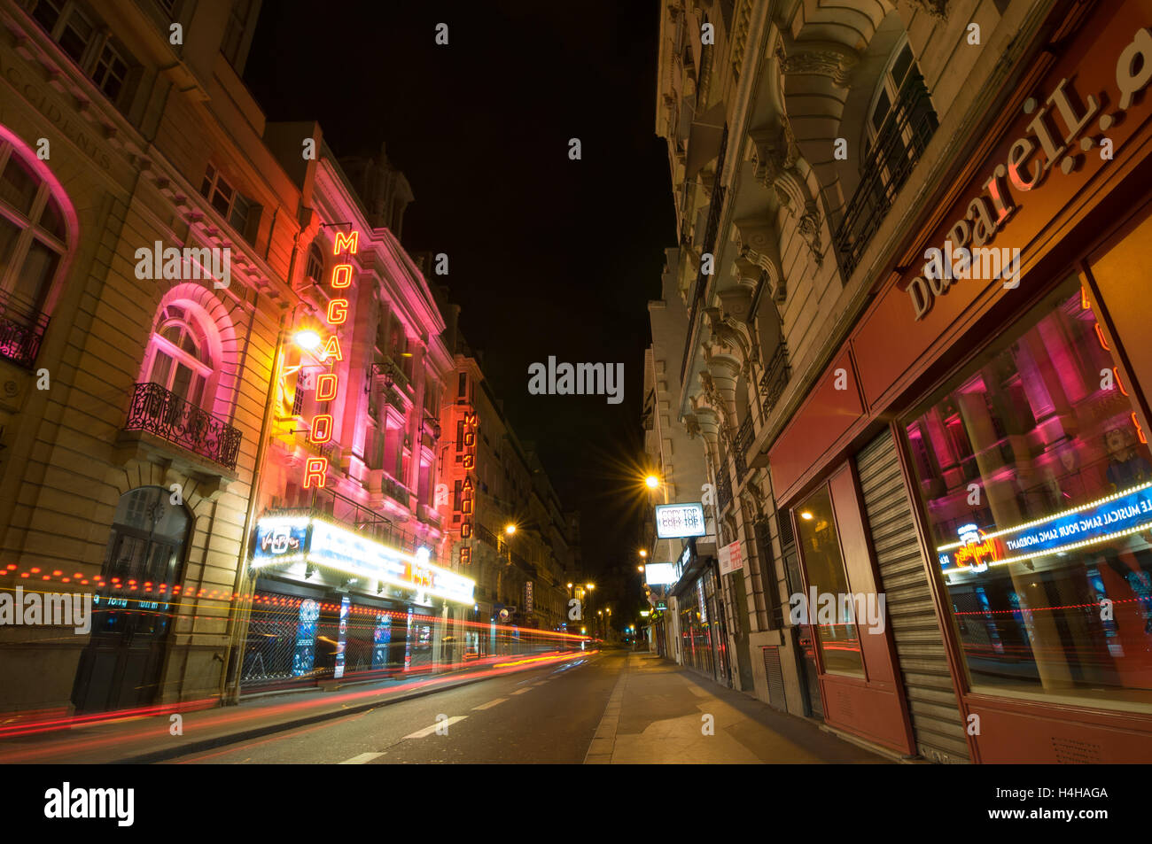 PARIS - SEPT 17, 2014: Traffic lights and night view of the Theatre Megador. Stock Photo