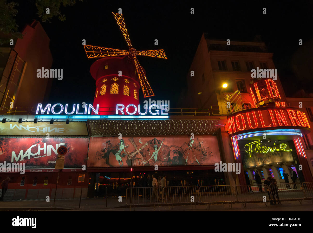 PARIS - SEPT 16, 2014: The Moulin Rouge at night. Moulin Rouge or French for Red Mill is a famous cabaret and theater. Stock Photo