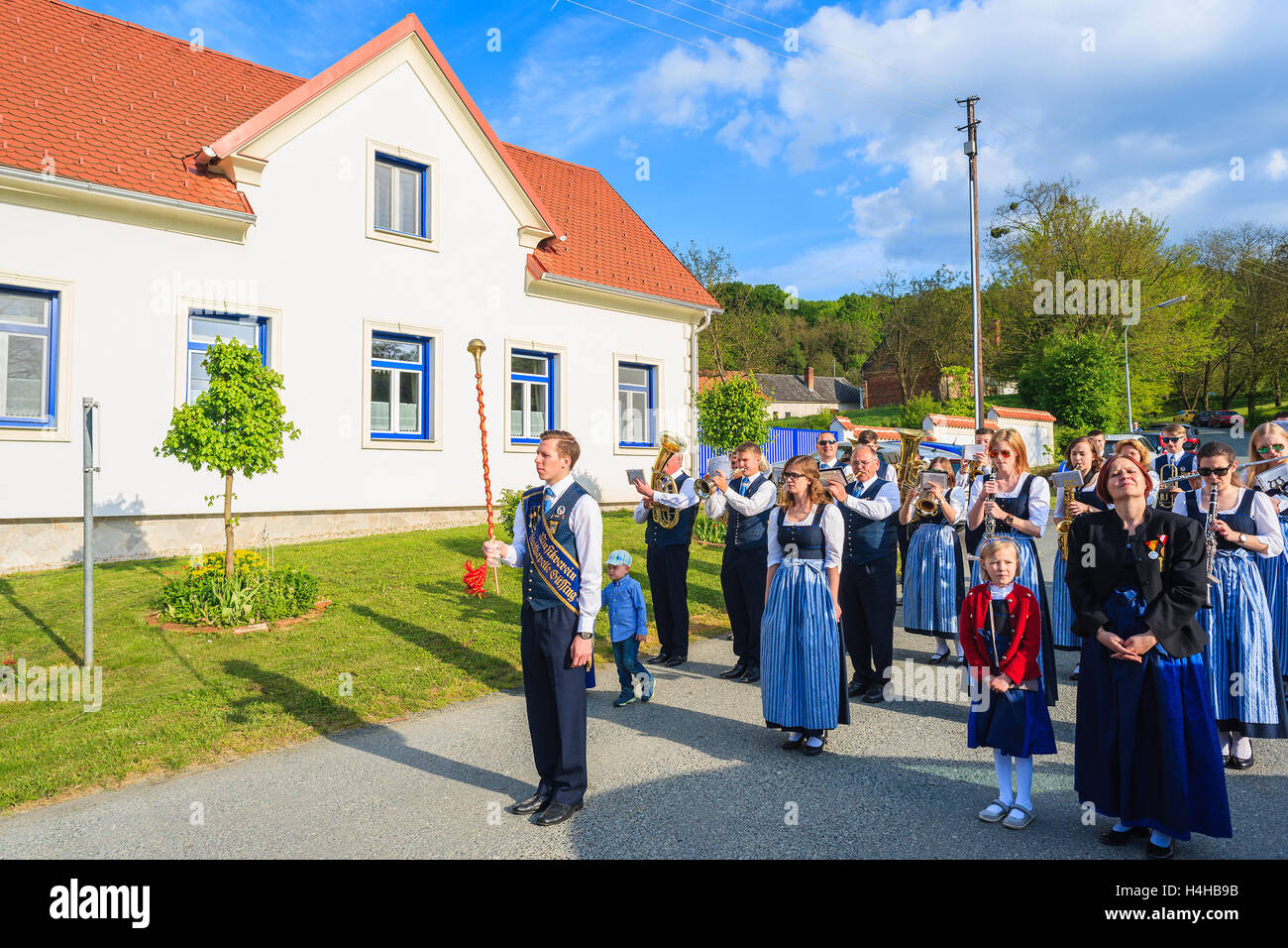 GLASING VILLAGE, AUSTRIA - APR 30, 2016: band playing music on village street during May Tree celebration. In Germany and Austri Stock Photo