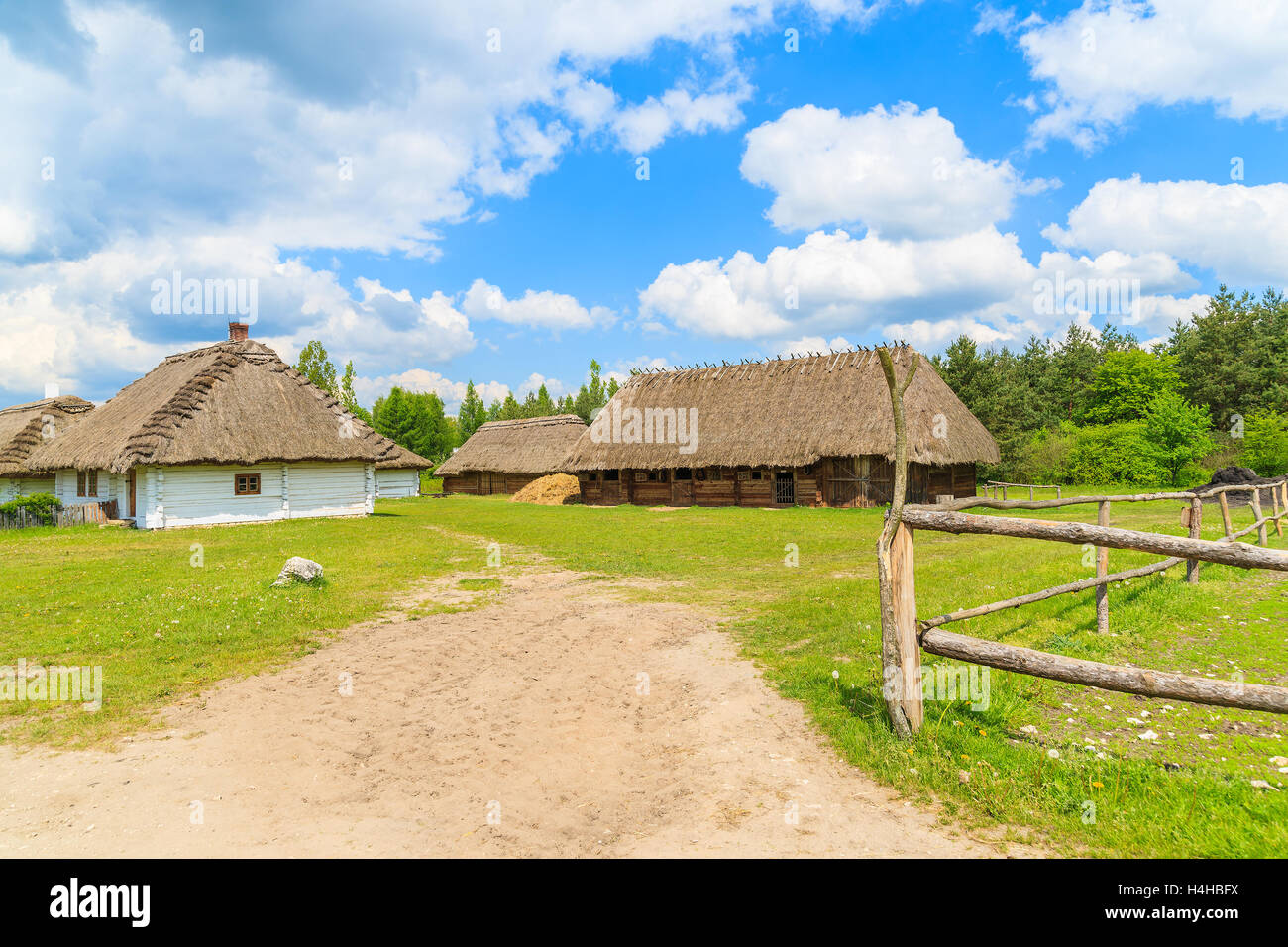 Rural road in Tokarnia village on sunny beautiful spring day, Poland Stock Photo