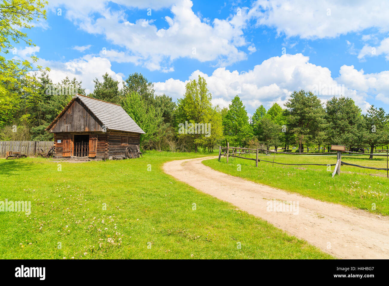 Rural road in Tokarnia village on sunny beautiful spring day, Poland Stock Photo