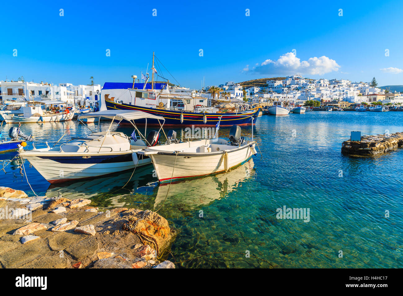 Fishing boats in Naoussa port at sunset time, Paros island, Cyclades, Greece Stock Photo