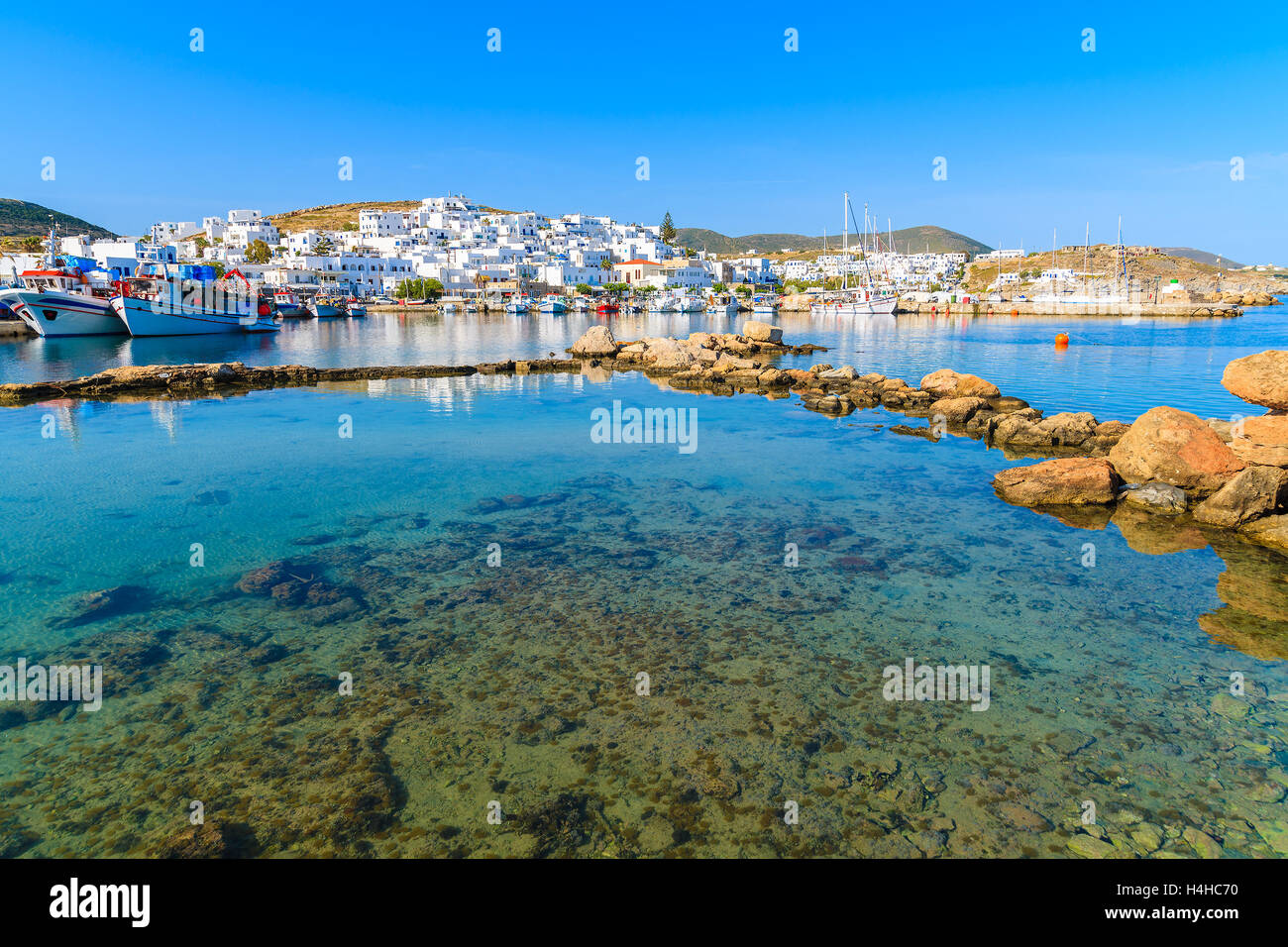 A view of Naoussa fishing port at sunset time, Paros island, Cyclades, Greece Stock Photo