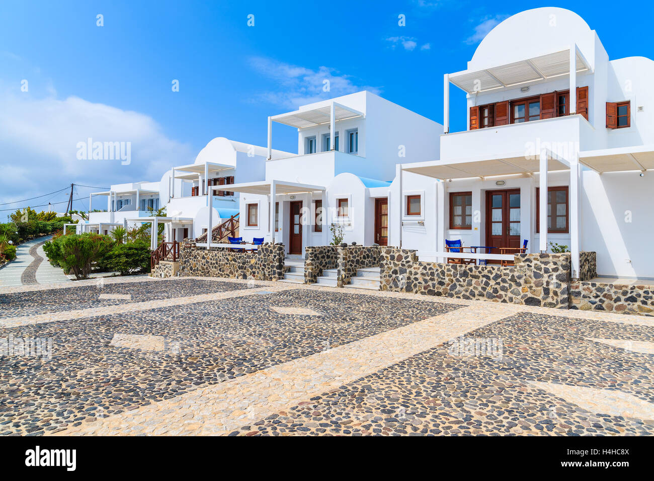 Traditional holiday apartments built in Greek style in Imerovigli vilage,  Santorini island, Greece Stock Photo - Alamy