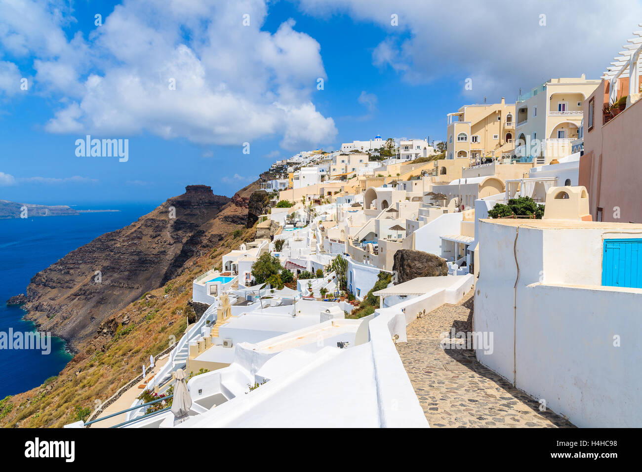 Footpath in Firostefani village with many boutique hotels built on cliff side, Santorini island, Greece Stock Photo