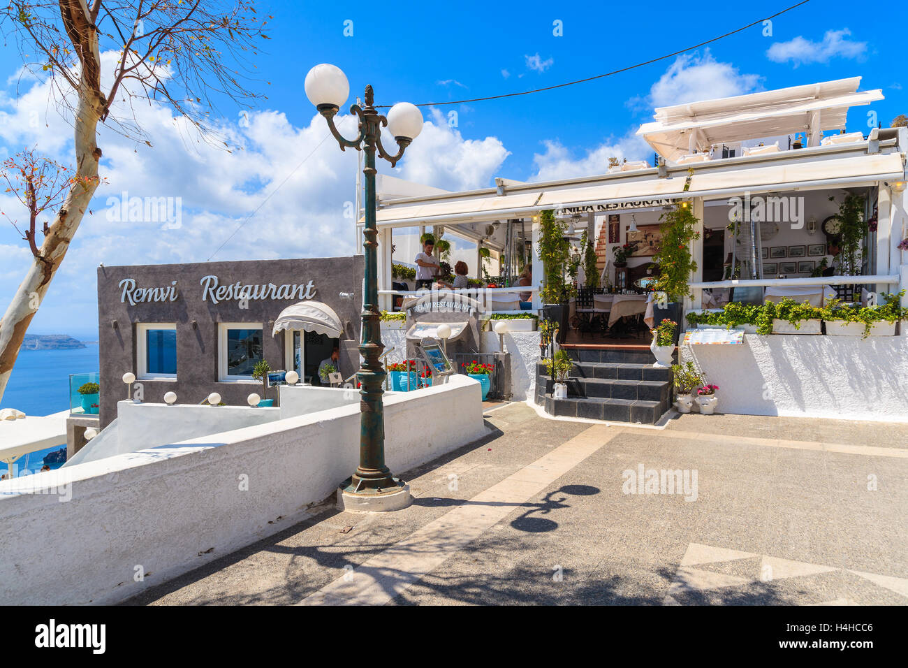 SANTORINI ISLAND, GREECE - MAY 22, 2016: typical Greek restaurant in Firostefani village on Santorini island, Greece. Stock Photo