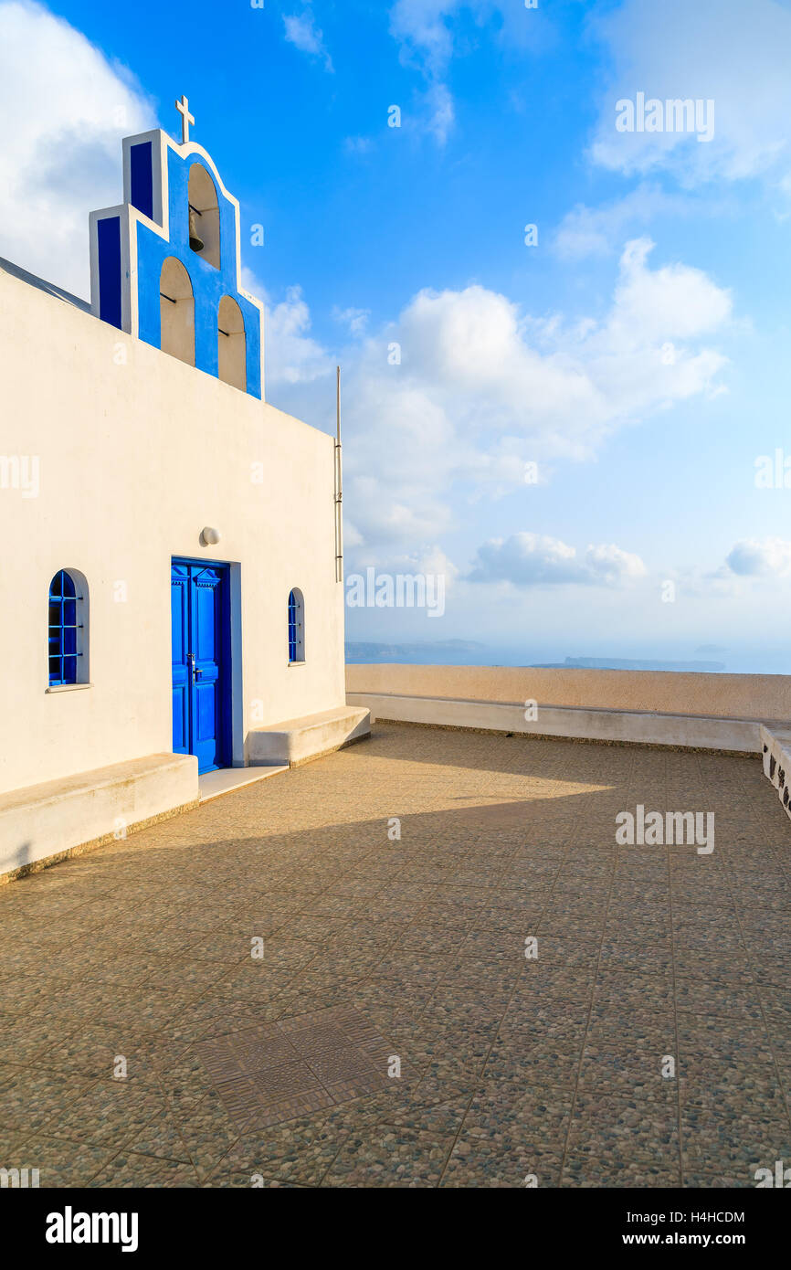 Typical Greek white church at sunet time in Imerovigli village, Santorini island, Greece Stock Photo