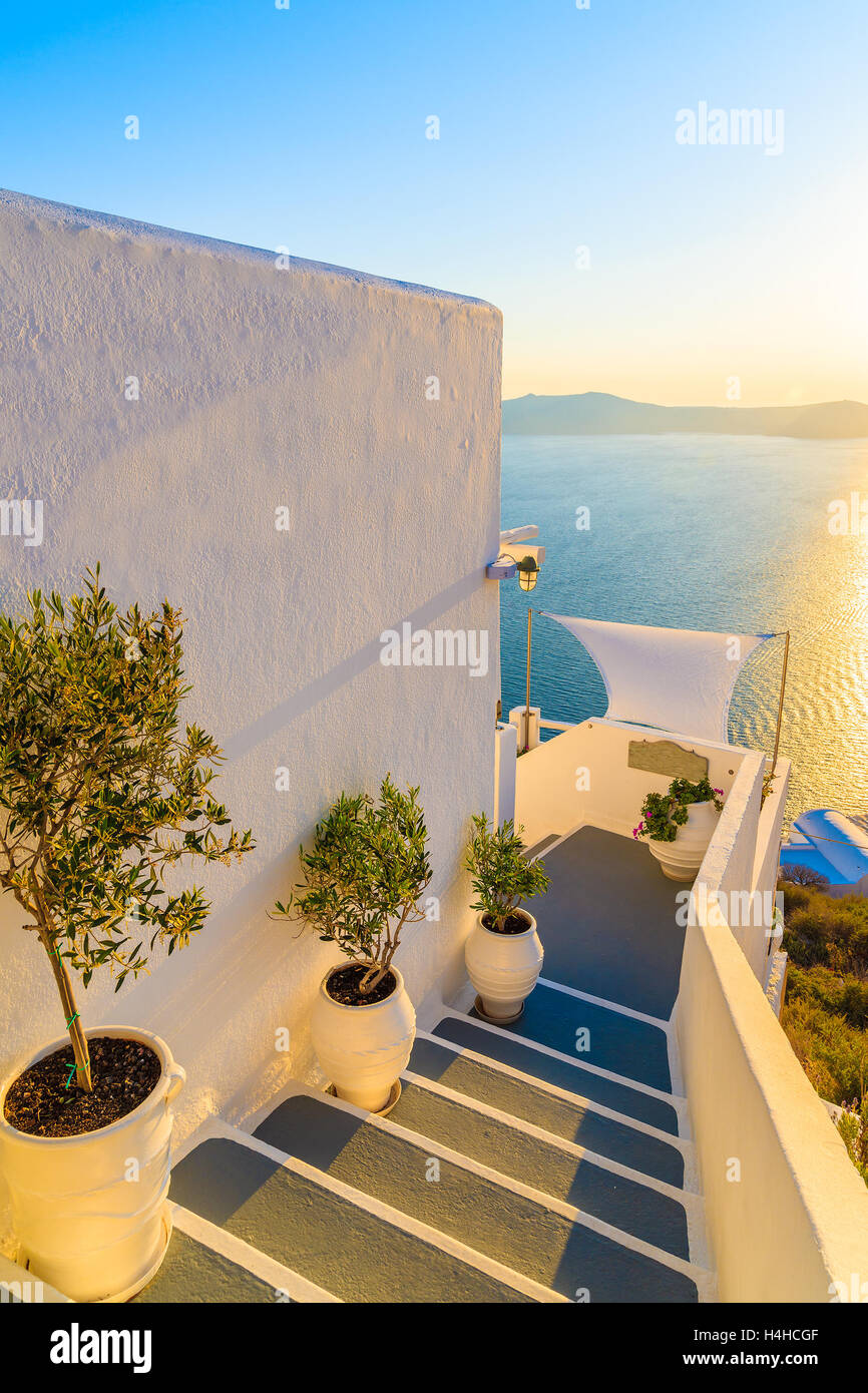 Steps in Firostefani village with sea in background at sunset time, Santorini island, Greece Stock Photo