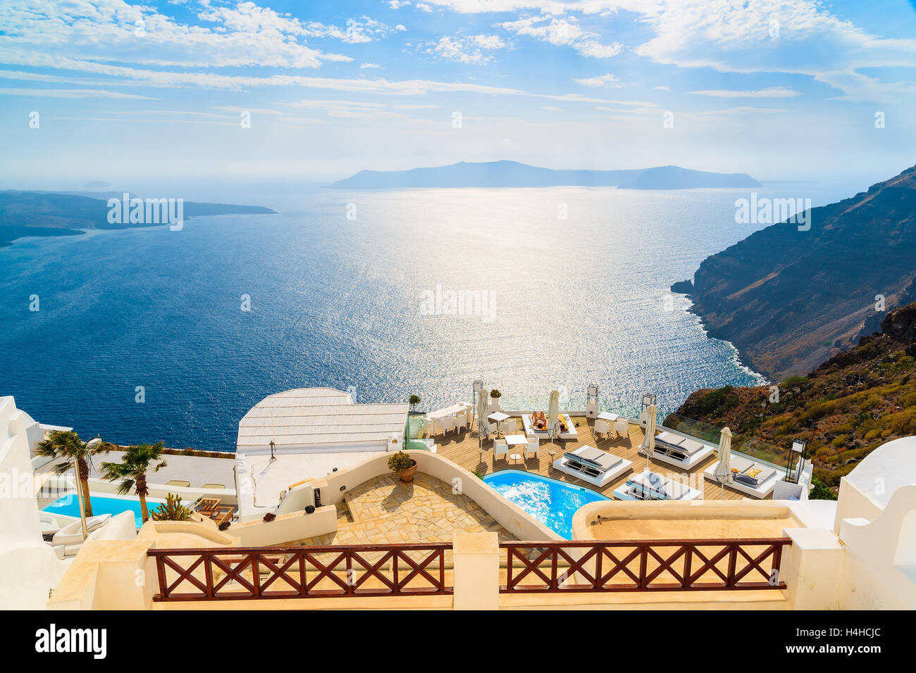 A view of beautiful sea and caldera with luxury hotel buildings, typical white architecture of Santorini island, Greece Stock Photo