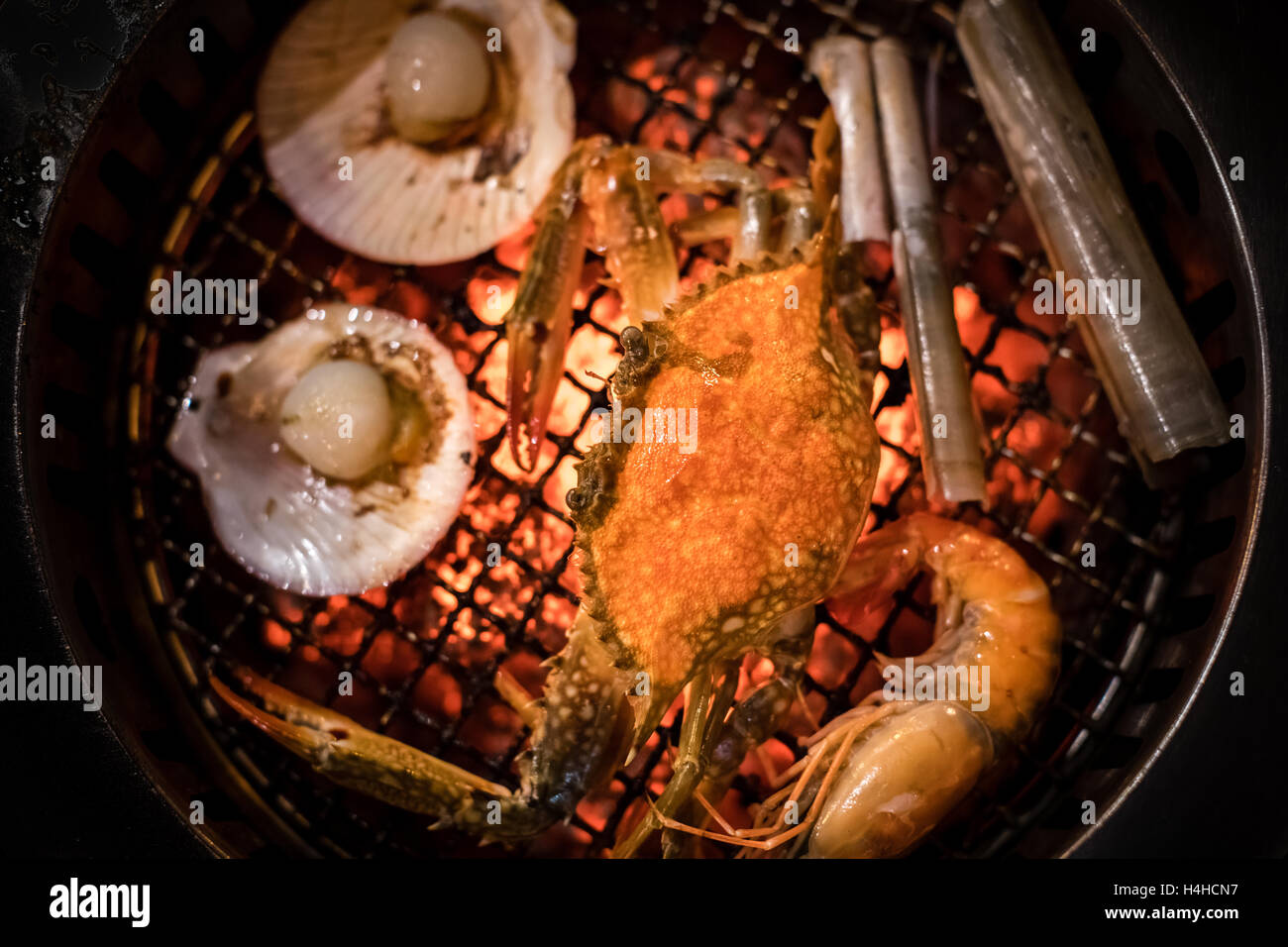 Barbecue grilled crab seafood cooking on hot flaming grill Stock Photo
