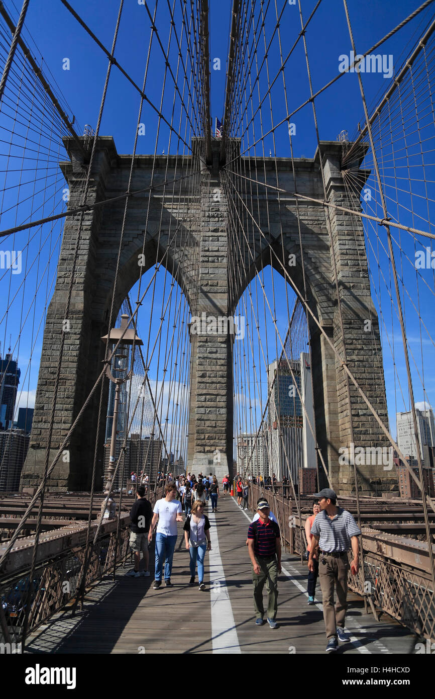 Tourists on Brooklyn Bridge, New York, USA Stock Photo
