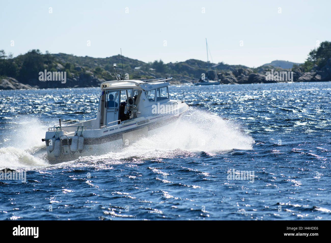 Small Boat On The Waves With Splashing Water Mandal Norway Stock small-boat-on-the-waves-with-splashing-water-mandal-norway-stock