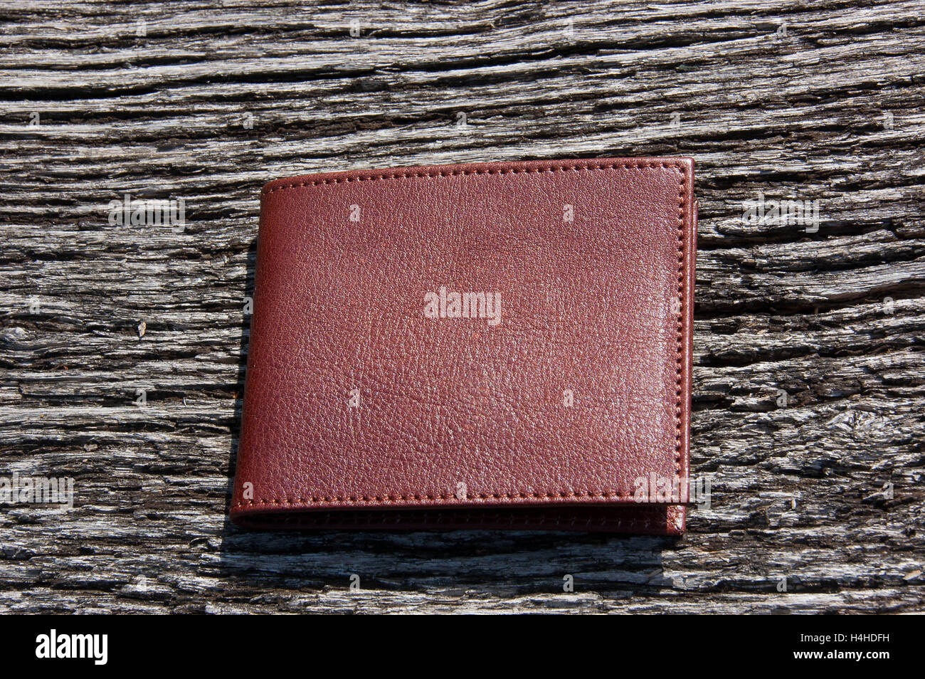 Leather wallets on a wooden table as background Stock Photo
