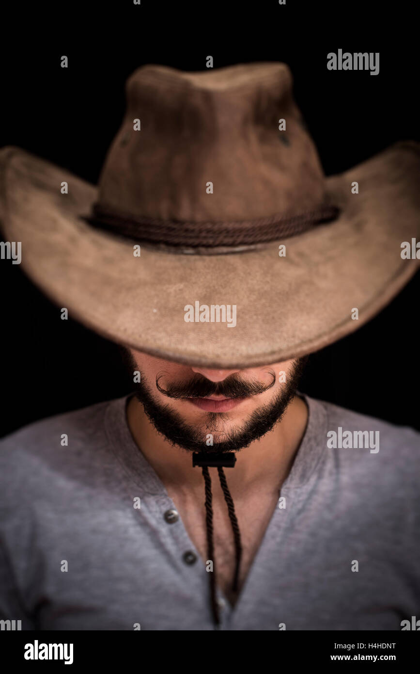 Cowboy portrait, and cowboys curled mustache Stock Photo