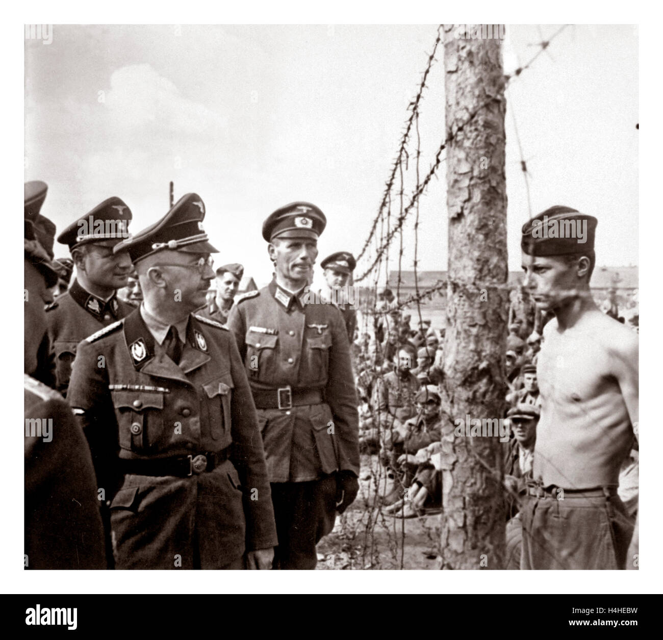 German Nazi leader Heinrich Himmler in uniform inspects a WW2 prisoner-of-war camp in Russia 1940's Stock Photo