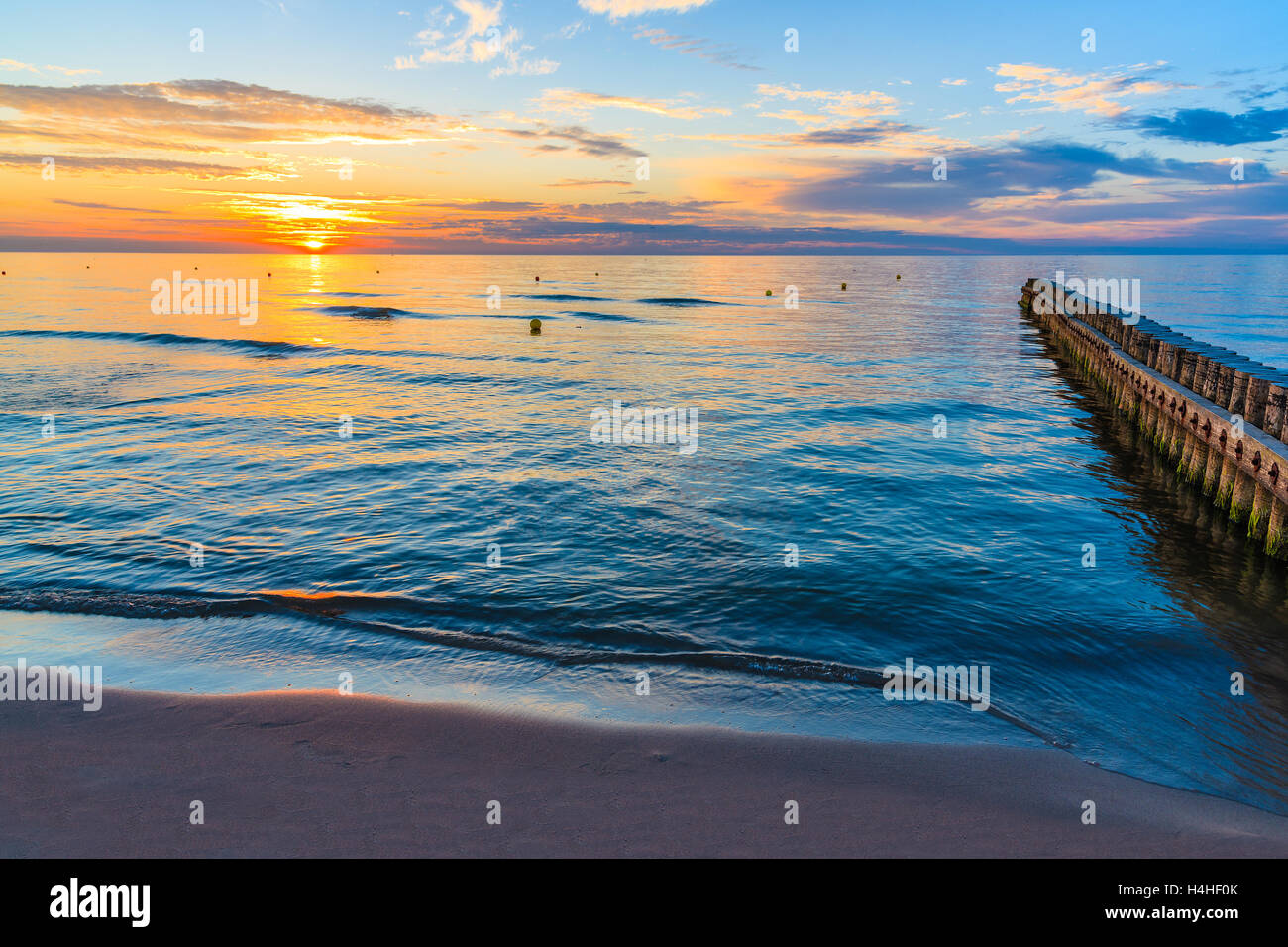Sunset over sea on a beach in Leba, Baltic Sea, Poland Stock Photo