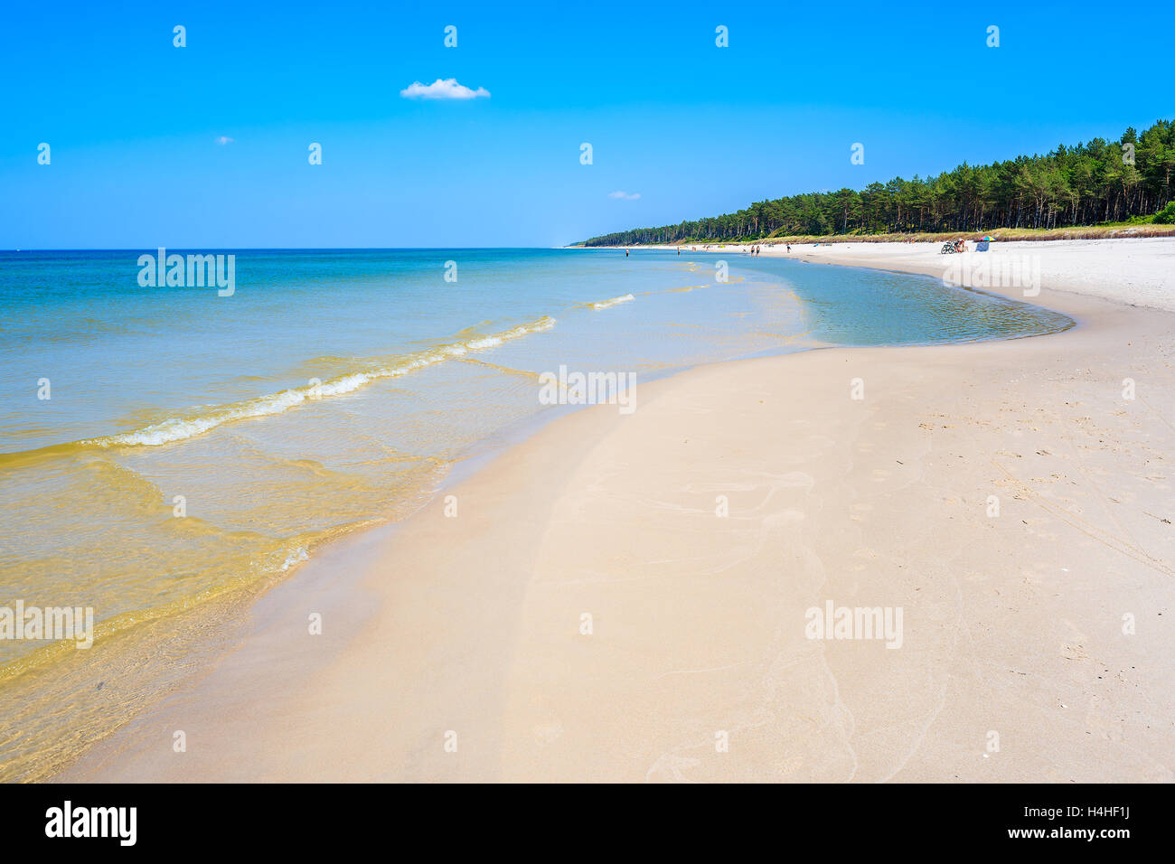 Sea waves on sandy beach in Lubiatowo coastal village, Baltic Sea, Poland Stock Photo