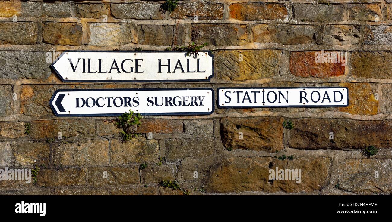 Village direction signs. village hall,doctors surgery, on station road Staithes North Yorkshire England UK Stock Photo