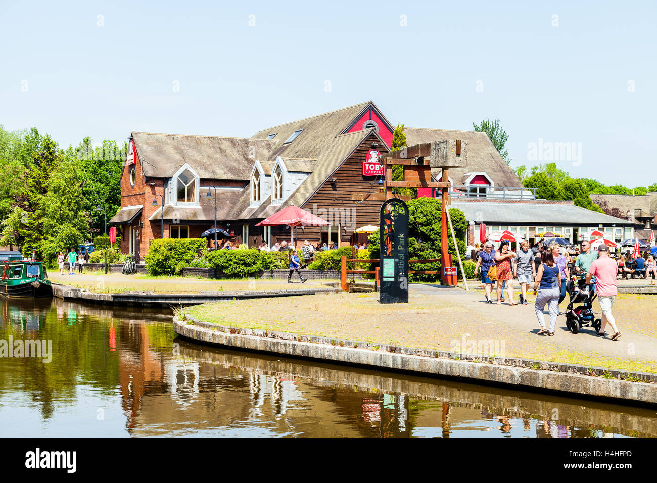 People enjoying a summers day at the Toby Inn carvey by the Trent canal ...