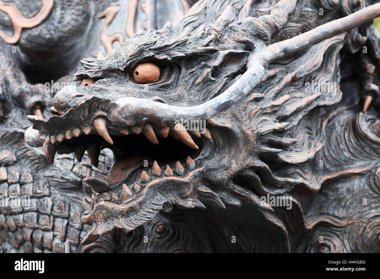 closeup of the head of a japanese dragon statue in kyoto Stock Photo