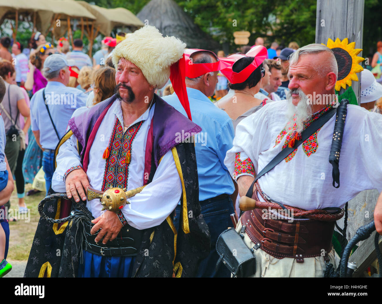 VELYKI SOROCHYNTSI, UKRAINE - AUGUST 20: Two cossacks at the All-Ukrainian fair crowded with people on August 20, 2016 Stock Photo
