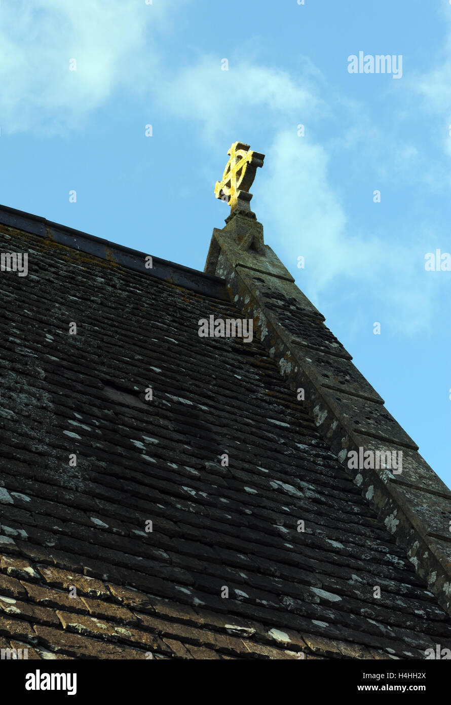 Ornate stone cross on the roof of St Catwg's Llangattock Parish Church.   Llangattock, Crickhowell, Powys, Wales. Stock Photo