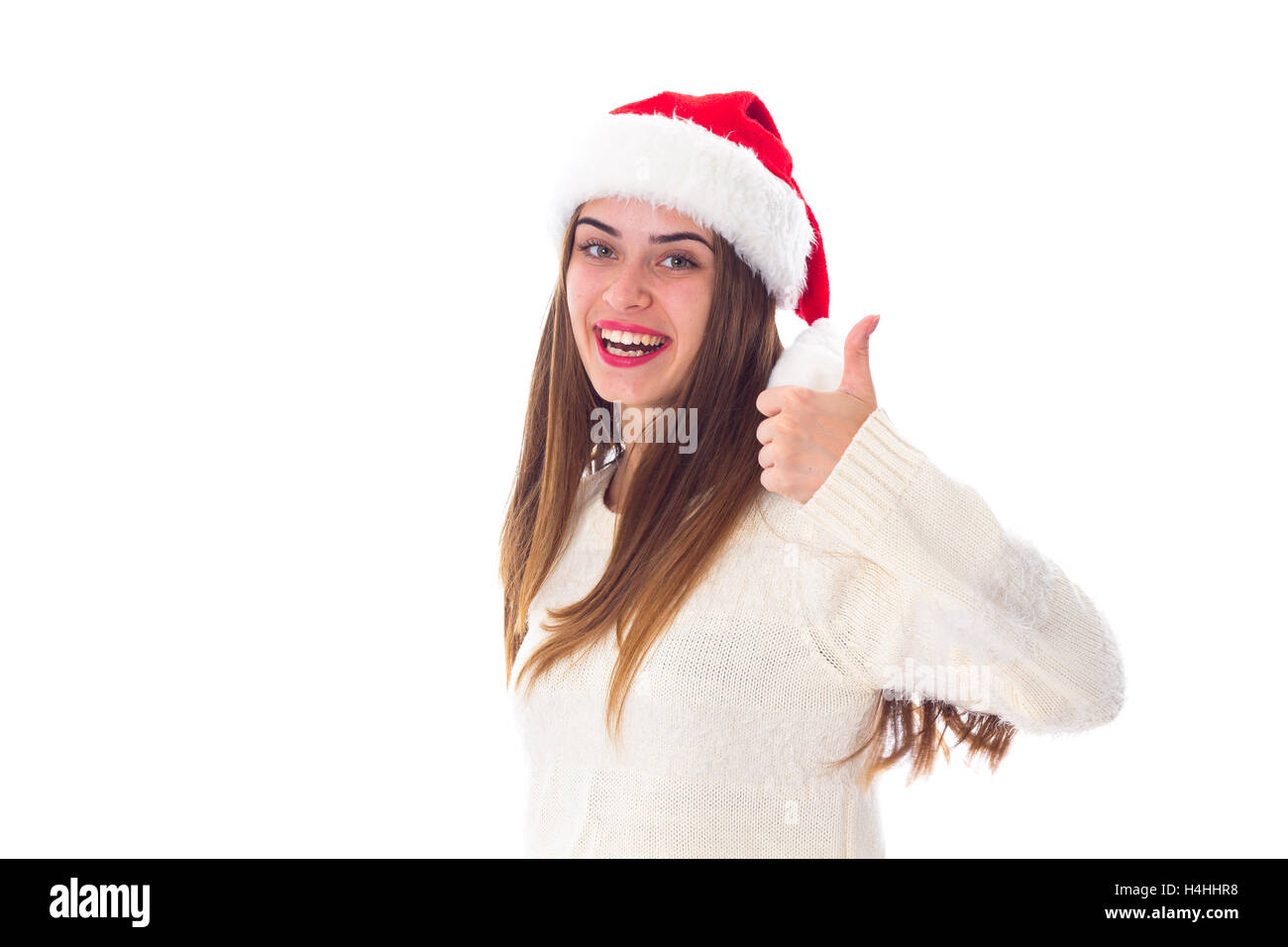 Woman in red christmas hat showing thumb up Stock Photo Alamy