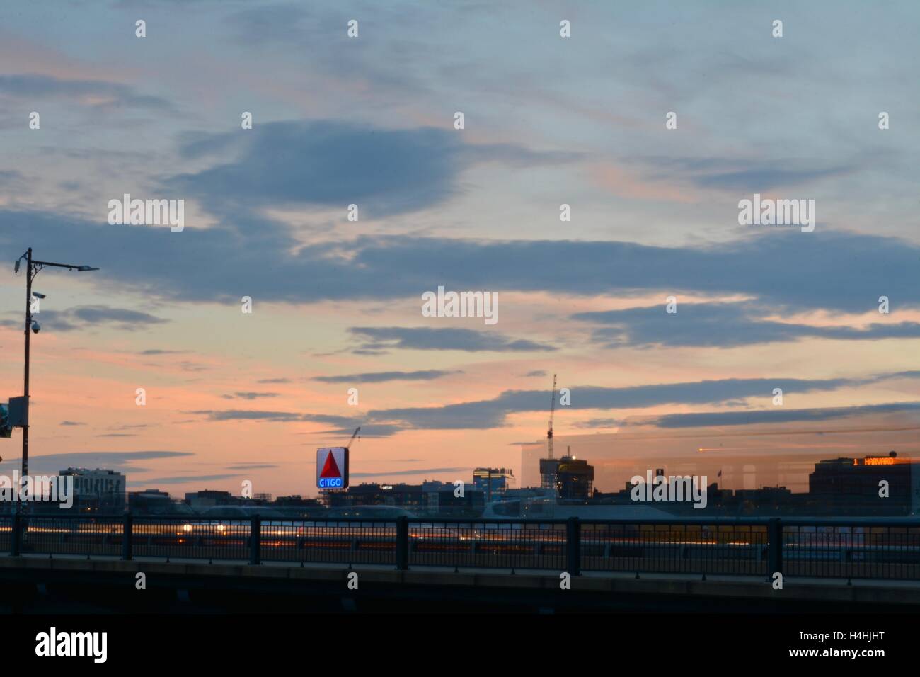 A long exopsure of the iconic Citgo sign above Kenmore Square in Boston, Massachusetts with a reddish pink evening sky. Stock Photo