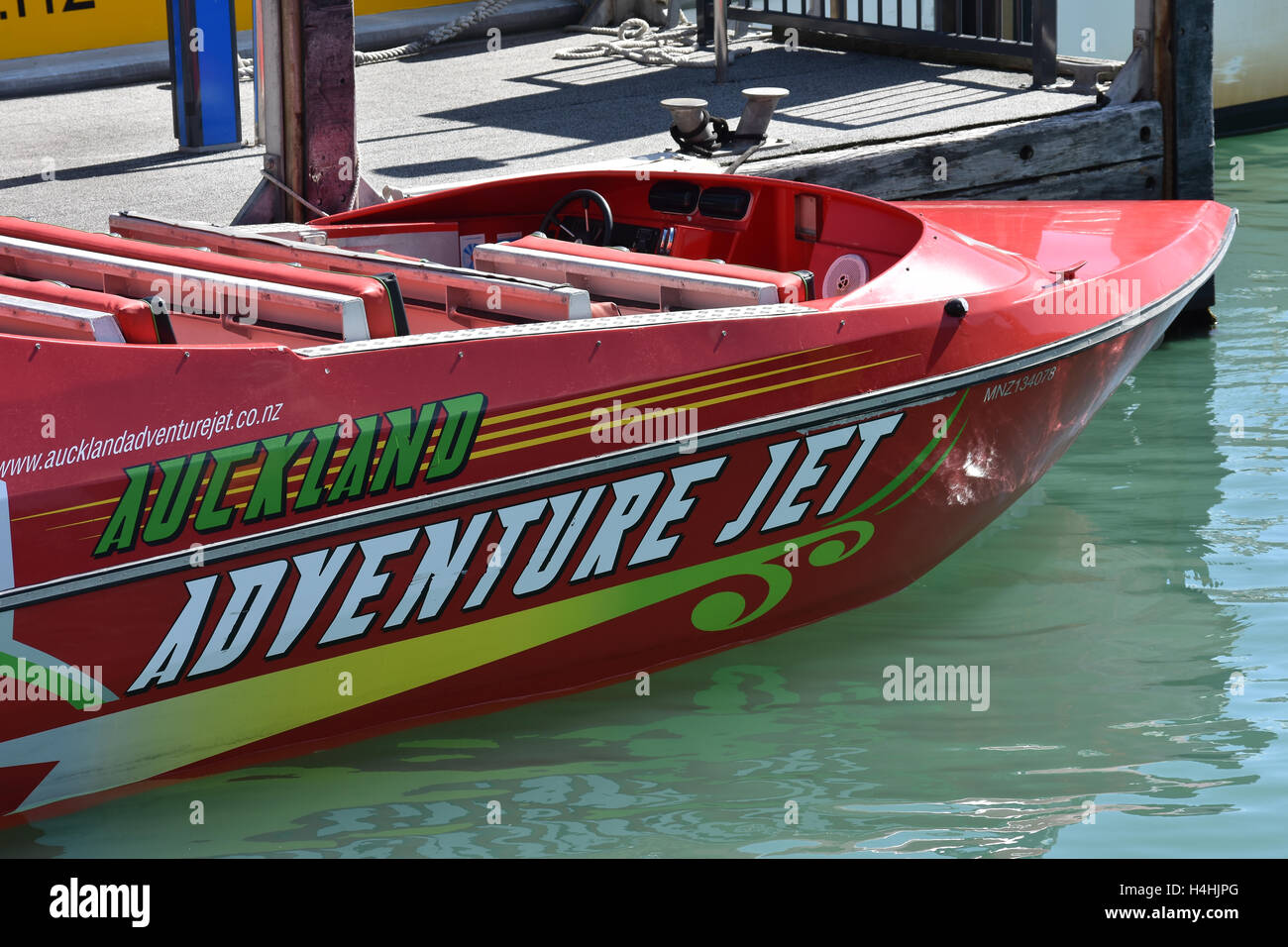 Red water jet powered speed boat berthed at wharf in Auckland downtown. Stock Photo