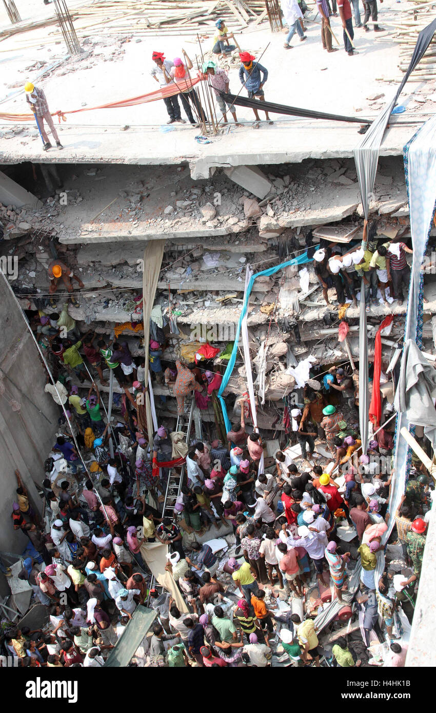 Bangladeshi People Gather As Rescuers Look For Survivors And Victims At The Site Of Rana Plaza 